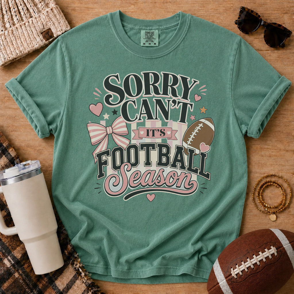Light Green Comfort Colors football mom shirt with boutique football season design and game day props.