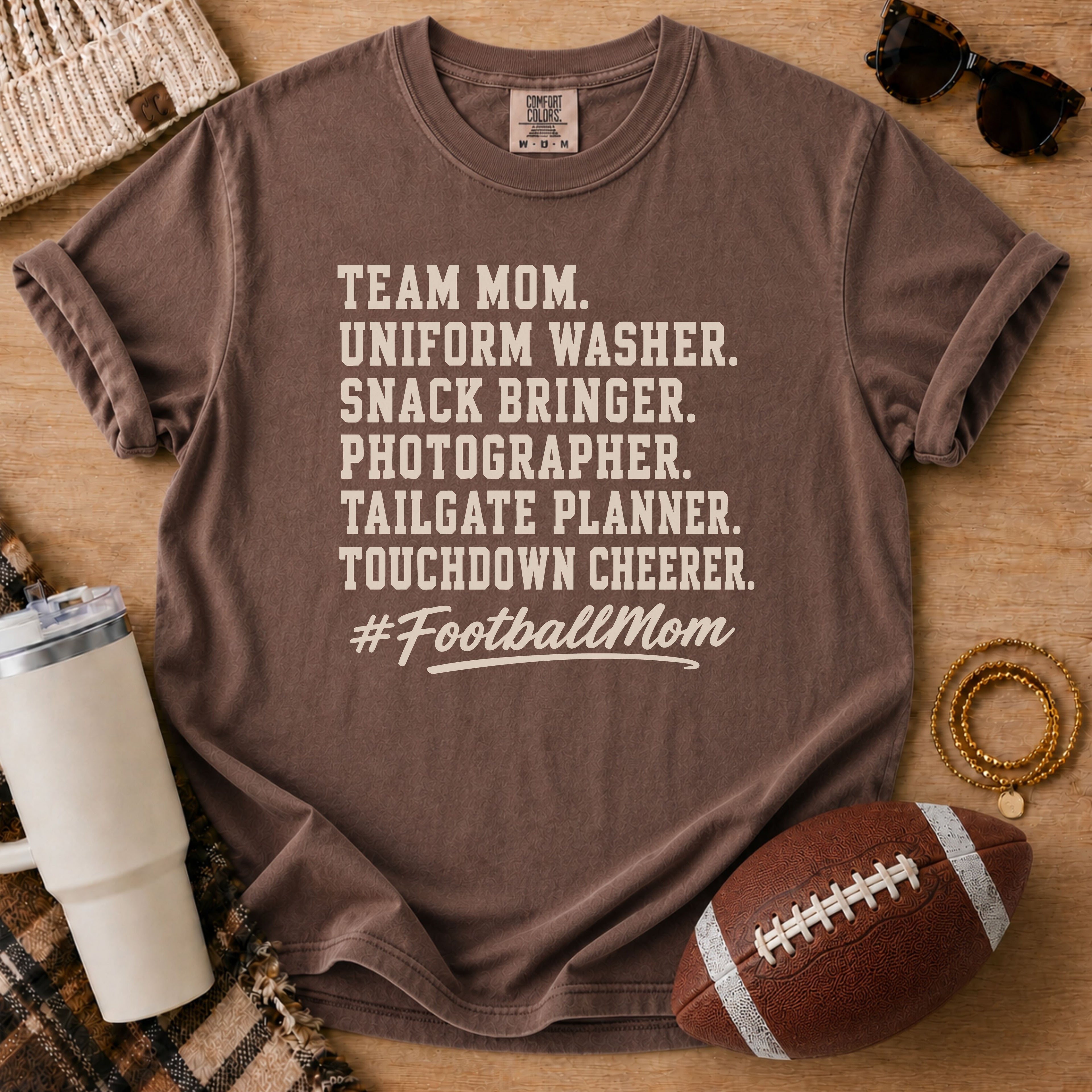 Super Football Mom football mom Comfort Colors tee in Espresso brown, styled with a football and tumbler