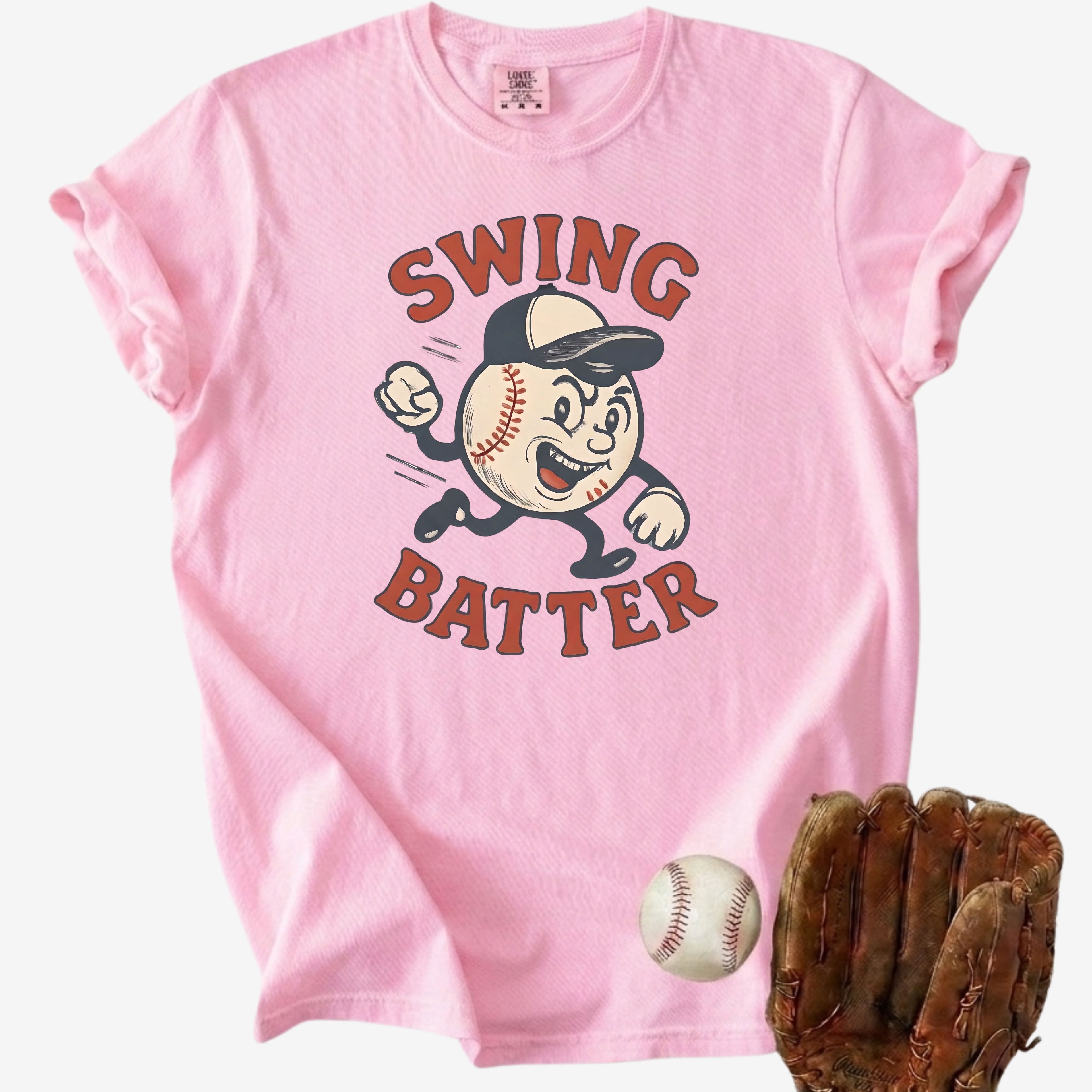 Retro pink baseball t-shirt with a cartoon baseball mascot and Swing Batter text next to a leather glove