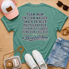 Team Mom Uniform Washer Snack Bringer baseball mom Comfort Colors Light Green tee flat lay with pink trucker hat, baseball purse, white sneakers, denim shorts, sunglasses, and jewelry.