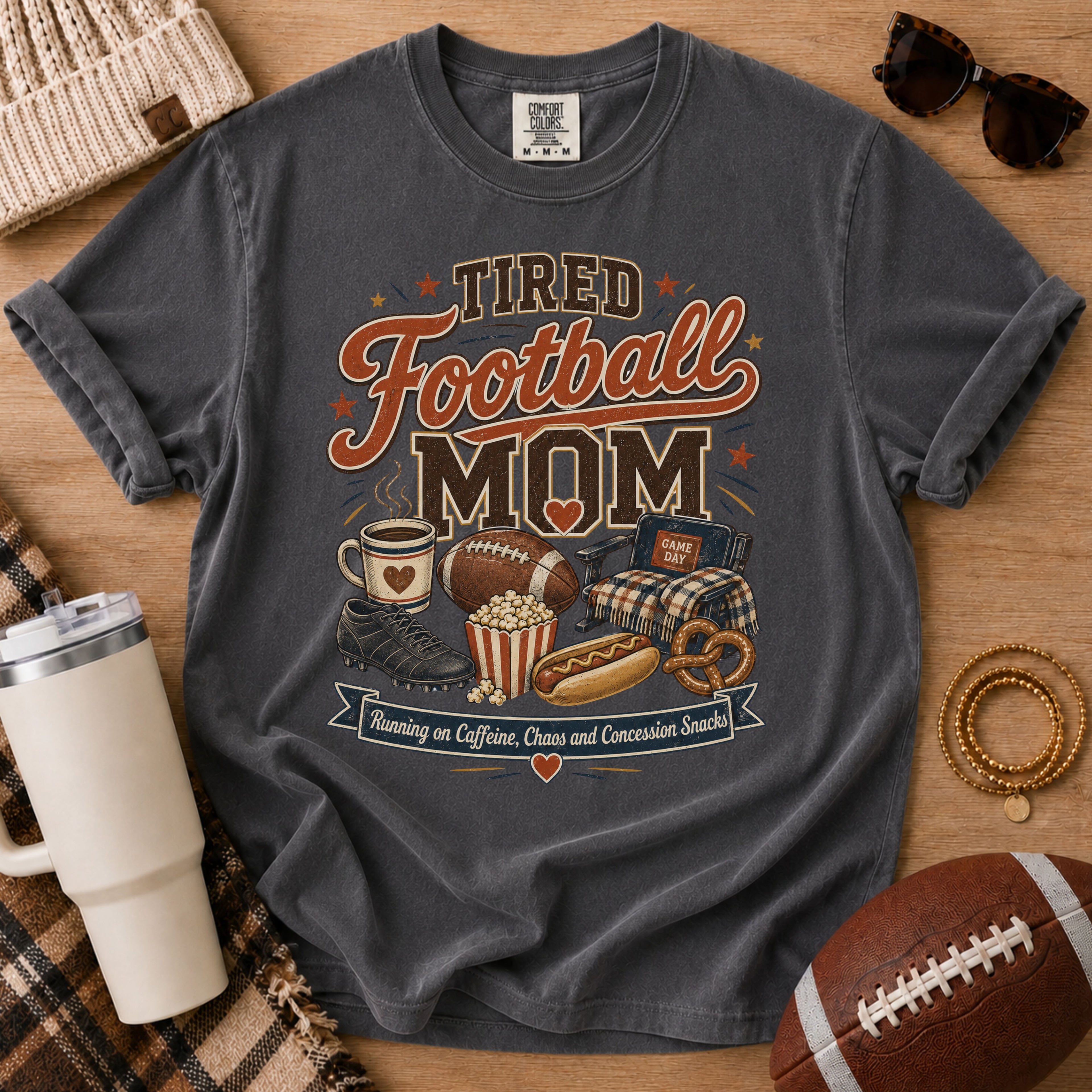 Pepper Comfort Colors football mom shirt with vintage tired football mom graphic.