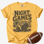 Vintage football game day T-shirt in golden yellow, Comfort Colors Mustard, shown with distressed “Night Games” lettering, a football and stadium lights.