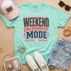 Weekend Tournament Mode Comfort Colors baseball mom shirt in chalky mint styled with denim shorts and game day accessories flat lay