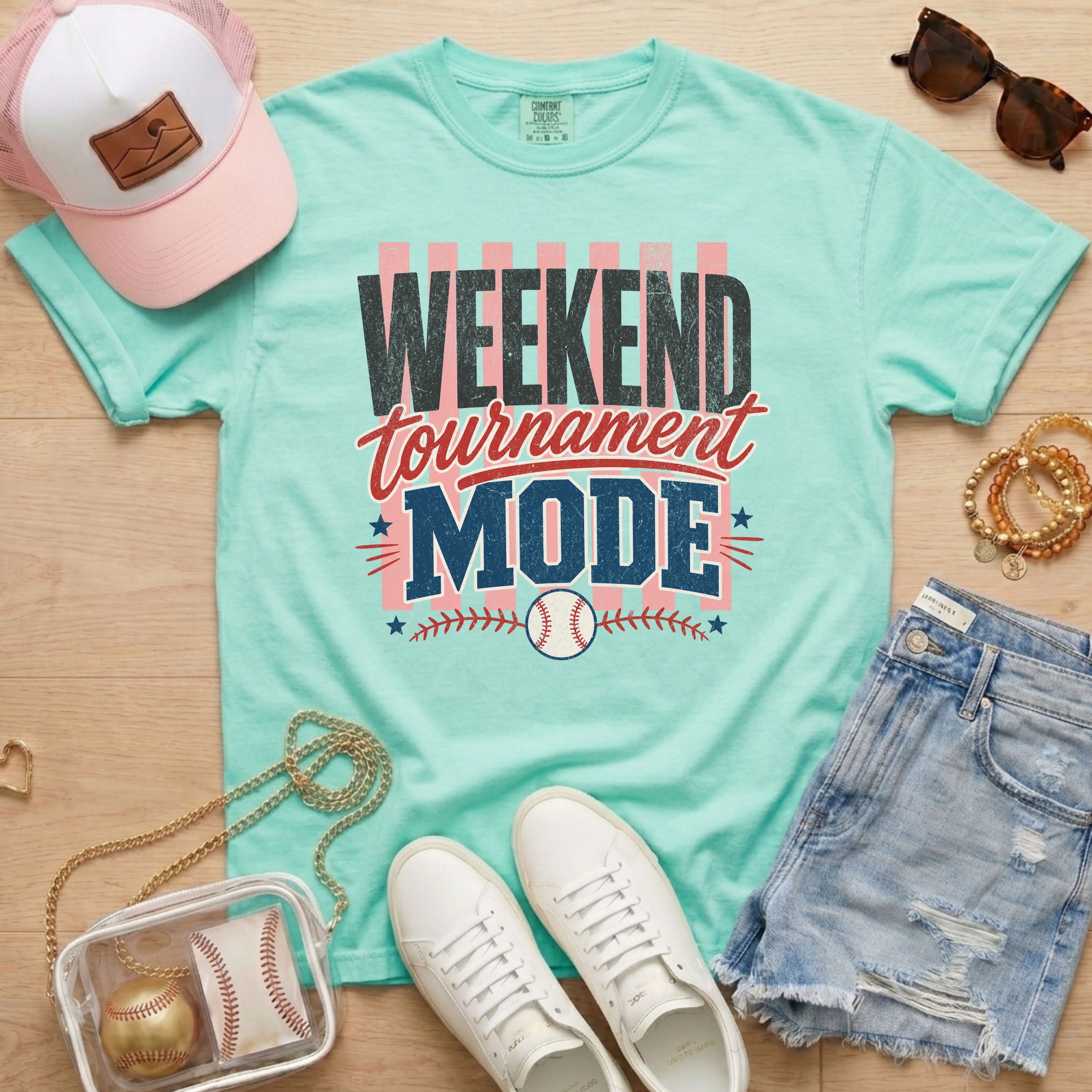 Weekend Tournament Mode Comfort Colors baseball mom shirt in chalky mint styled with denim shorts and game day accessories flat lay