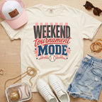 Weekend Tournament Mode Comfort Colors baseball mom shirt in ivory styled with denim shorts and game day accessories flat lay